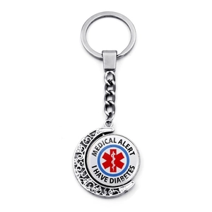Detail of rotating medical alert keychain with Star of Life and I HAVE DIABETES text