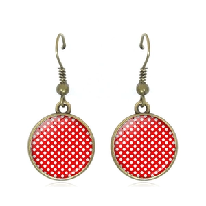 Vintage red polka dot drop earrings with bronze finish hooks and glass dome detail