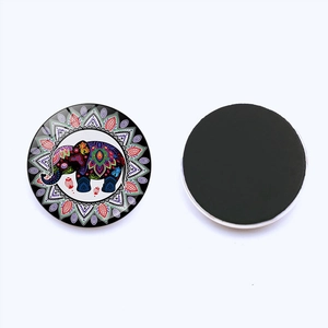 Detailed view of colorful elephant mandala glass fridge magnets with black magnetic back