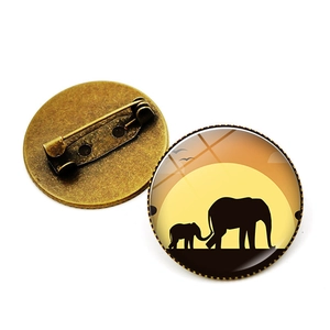 Retro bronze elephant silhouette glass cabochon brooch with a secure safety pin clasp