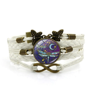Bohemian multi-layer leather bracelet with dragonfly, moon, and butterfly charms