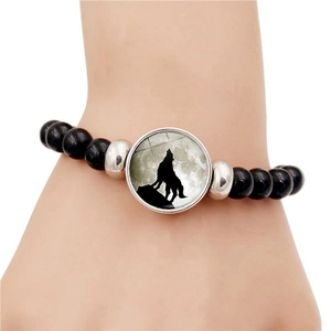 Luminous howling wolf moon black beaded elastic bracelet with glowing moonlit charm