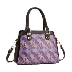 Fashionable fish scale pattern handbag in purple tones with brown leather straps