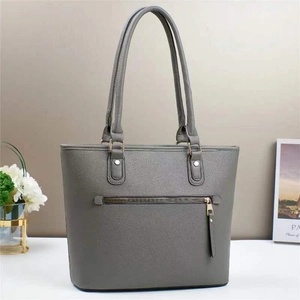 Minimalist dark grey leather bucket bag with gold hardware and back zipper pocket