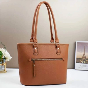 Brown macaron bucket tote bag with lychee texture and front zipper pocket for women