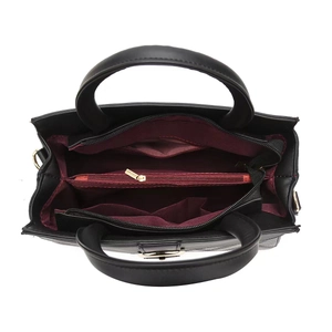 Top view of tote bag interior with three compartments and burgundy lining detail