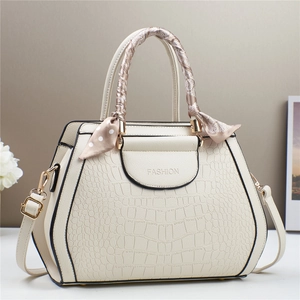 Elegant stone pattern tote bag in creamy white with silk scarf handle and golden hardware