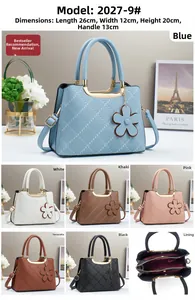 Detail view of large quilted tote bags in various colors with floral charm and inner pockets