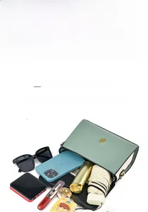 Litchi pattern mint green crossbody bag showing large capacity for daily essentials
