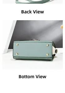 Detail view of the bag bottom showing four golden protective studs and green leather texture