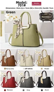 Detailed interior compartment and multiple color options for the paneled crossbody handbag