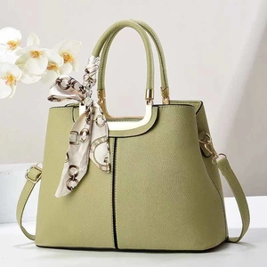 Olive green lychee leather handbag with golden hardware and silk scarf decoration