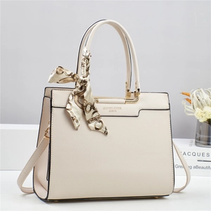 Chic beige lychee leather bucket bag with top handles and decorative silk scarf detail