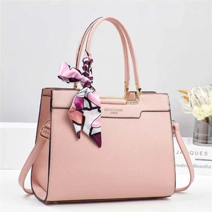 Pink lychee grain leather bucket bag with top handle and floral scarf decoration