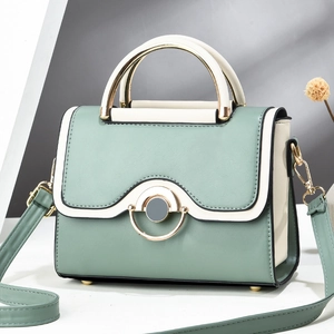 Chic patchwork green and beige crossbody handbag with stylish gold ring hardware accent