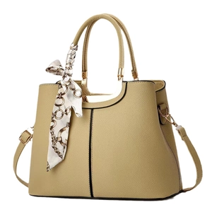 Khaki pebbled leather tote bag with gold metal handles and decorative silk scarf detail