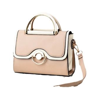 Chic two-tone crossbody handbag with golden metal clasp and adjustable shoulder strap