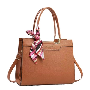 Brown lychee grain bucket bag with decorative silk scarf and adjustable strap
