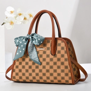 Vintage checkerboard tote bag with brown leather handles and decorative silk scarf