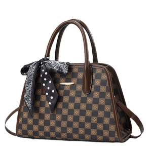 Brown checkerboard tote bag with floral accents and silk scarf detail on handle