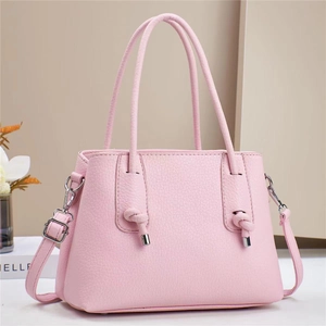 Pink lychee texture leather handbag with adjustable strap and knot detail for women