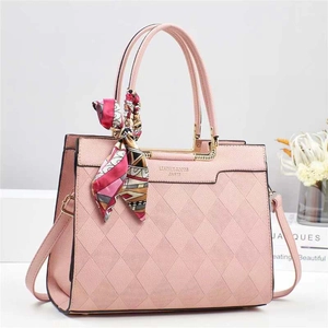 Pink quilted bucket bag for women with top handle, silk scarf detail and shoulder strap