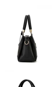 Detailed close-up of high-quality lychee texture leather with elegant gold hardware buckles