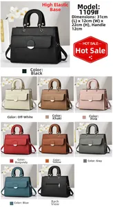 Close-up of pebble leather handbag detailing with magnetic buckle and 31x12x22cm size chart