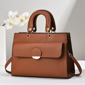 Classic brown lychee textured handbag with gold hardware and detachable shoulder strap