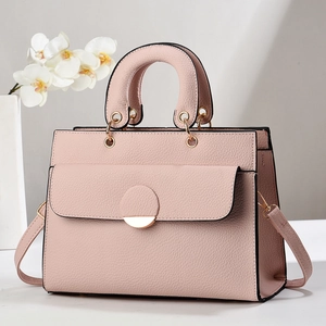 Pink lychee texture tote bag with gold metal hardware and detachable shoulder strap