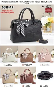 Detail view of large stone pattern bucket bag showing internal zipper layers and six colors