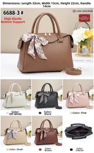Close-up of litchi texture boston bag with polka dot scarf and multi-color options