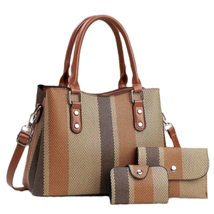 Three-piece striped canvas tote bag set with earthy tones and brown faux leather handles