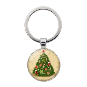 Vue détaillée du porte-clés en alliage argenté avec pendentif illustré d'un sapin de Noël