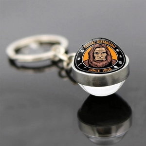 Macro detail of Bigfoot glass ball keychain with clear double-sided dome and silver ring