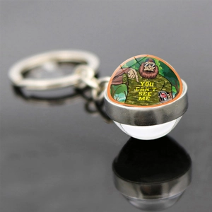 Detail of keychain featuring Bigfoot glass dome with You Can't See Me text on black surface