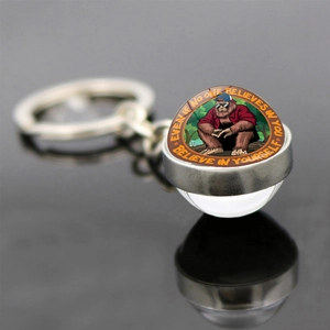 Macro shot of Bigfoot keychain with glass lens and motivational quote engraving