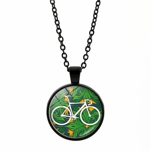Vintage bicycle pendant necklace with tropical leaf pattern and black metal chain