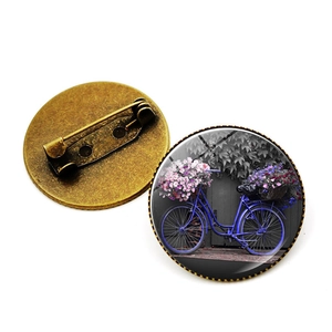 Broche vélo vintage en bronze avec dôme en verre et motif floral pour vêtements