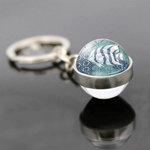 Vintage tropical fish glass ball keychain with silver metal ring and ocean lace patterns