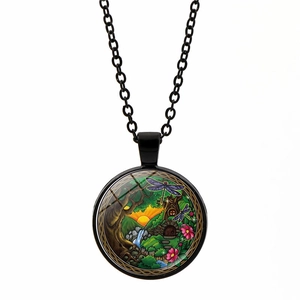 Detail of mandala magic forest pendant with vintage illustration and black metal chain