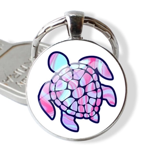 Porte-clés tortue rond en métal argenté avec motif artistique en verre rose et bleu