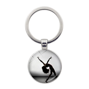 Portachiavi con silhouette di ballerina in argento e ciondolo in vetro su sfondo bianco