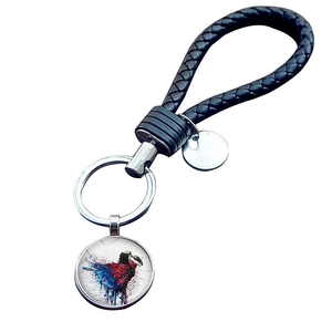 Portachiavi ballerina con cinturino in pelle intrecciata e ciondoli in vetro artistico