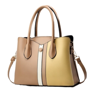 Chic color-block tote bag with top handles and adjustable strap in neutral tones