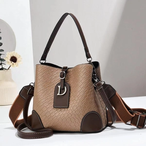 Brown stone textured bucket bag with wide strap and D-letter charm for women