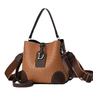 Brown stone pattern bucket bag with leather accents and D-shaped metal charm