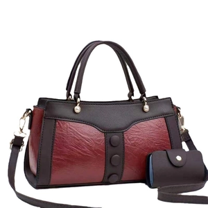 Women's color-block tote bag with small coin purse and elegant pearl handle accents