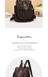 Detail of high-quality synthetic leather texture and golden brand logo on a brown backpack