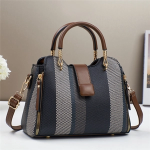 Sac fourre-tout en toile contrastée avec lanières en cuir marron et détails dorés